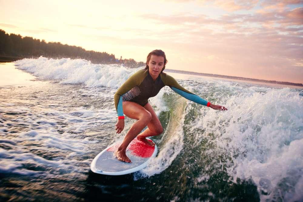 Which female surfer has the most world titles?